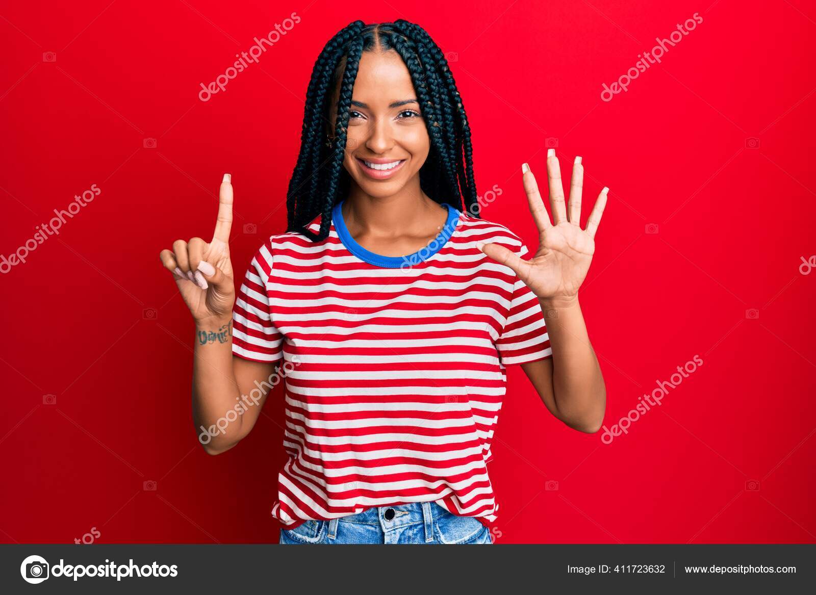 Beautiful Hispanic Woman Wearing Casual Clothes Showing Pointing