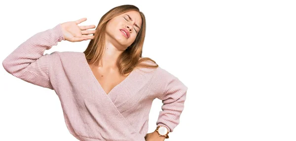 Beautiful Blonde Woman Wearing Casual Winter Pink Sweater Stretching Back — Stock Photo, Image