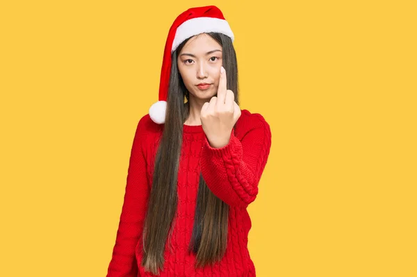 Young Chinese Woman Wearing Christmas Hat Showing Middle Finger Impolite — Stockfoto