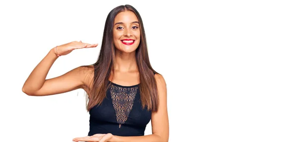 Young Hispanic Woman Wearing Casual Clothes Gesturing Hands Showing Big — Stock Photo, Image