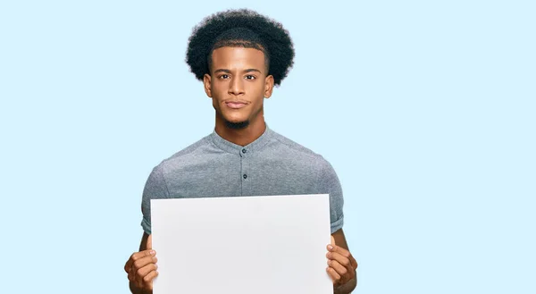African American Man Afro Hair Holding Blank Empty Banner Thinking — Stock Photo, Image