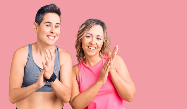 Couple Women Wearing Sportswear Clapping Applauding Happy Joyful Smiling Proud — Stock Photo, Image