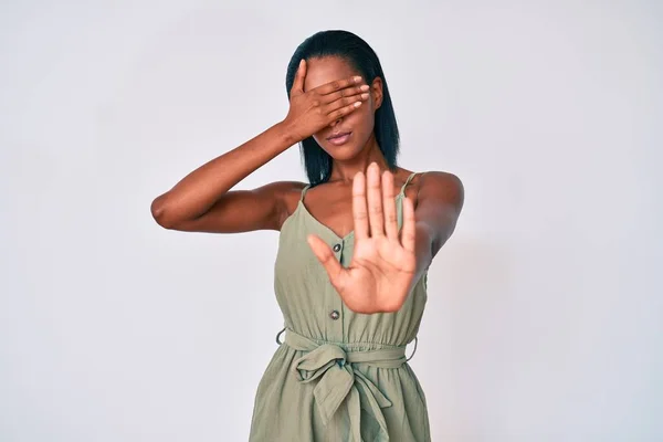 Young African American Woman Wearing Casual Clothes Covering Eyes Hands — Stock Photo, Image