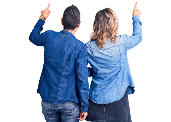 Couple Women Wearing Casual Clothes Posing Backwards Pointing Ahead Finger — Stock Photo, Image