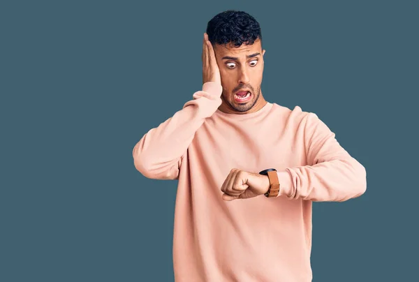 Young Hispanic Man Wearing Casual Clothes Looking Watch Time Worried — Stock Photo, Image