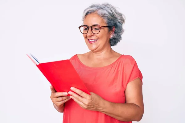 Senior Hispanic Woman Wearing Glasses Holding Book Looking Positive Happy — Stock Photo, Image