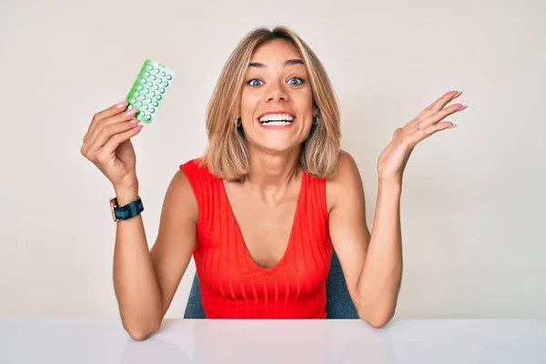 Beautiful Caucasian Woman Holding Birth Control Pills Celebrating Victory Happy — Stock Photo, Image