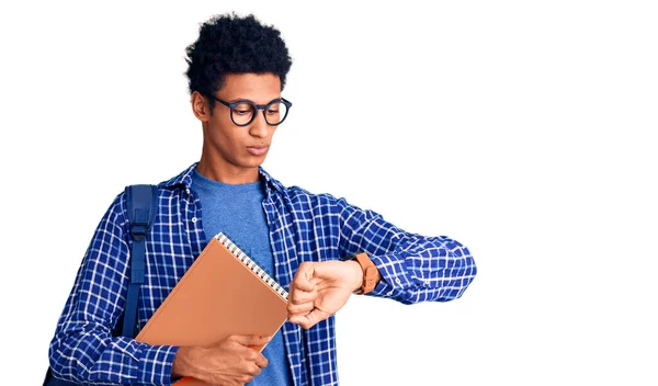 Young African American Man Wearing Student Backpack Holding Book Checking — Stock Photo, Image
