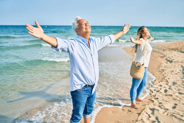 Middle Age Hispanic Couple Breathing Arms Raised Beach — Stock Photo, Image