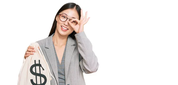 Young Chinese Woman Wearing Business Suit Holding Dollars Bag Smiling — Stock Photo, Image