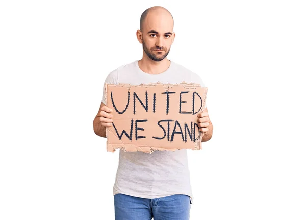 Young Handsome Man Holding United Stand Banner Thinking Attitude Sober — Stock Photo, Image