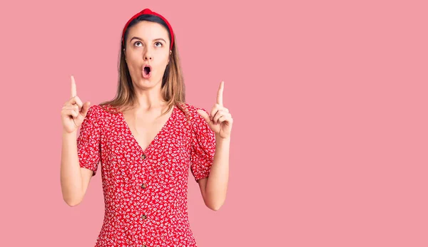 Young Beautiful Girl Wearing Dress Diadem Amazed Surprised Looking Pointing — Stock Photo, Image