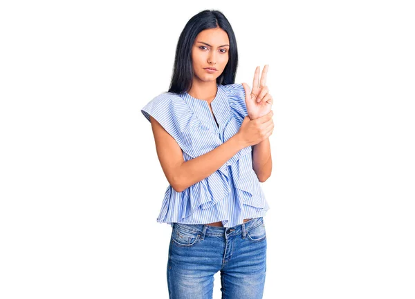 Young Beautiful Latin Girl Wearing Casual Clothes Holding Symbolic Gun — Stock Photo, Image