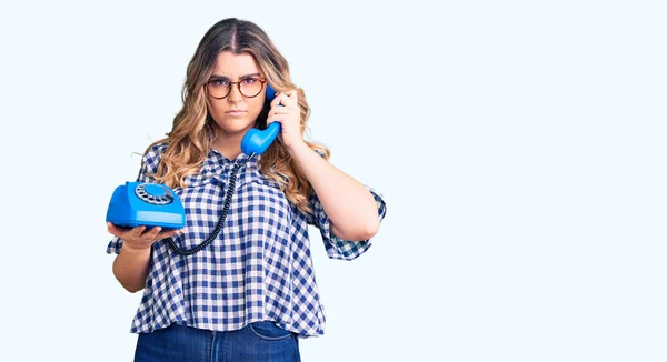 Young Caucasian Woman Holding Vintage Telephone Thinking Attitude Sober Expression — Stock Photo, Image