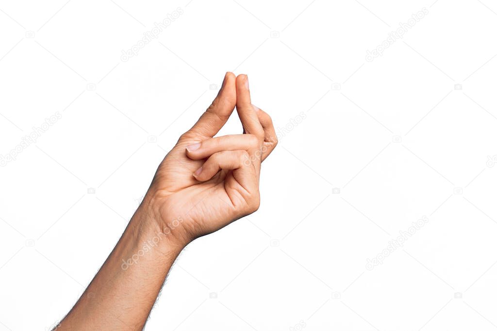 Hand of caucasian young man showing fingers over isolated white background snapping fingers for success, easy and click symbol gesture with hand