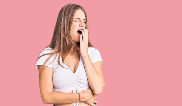 Young Beautiful Blonde Woman Wearing Casual White Tshirt Bored Yawning — Stock Photo, Image