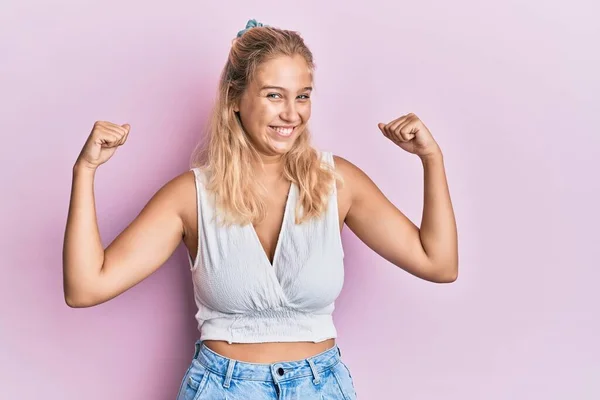 Young Blonde Girl Wearing Casual Clothes Showing Arms Muscles Smiling — Stock Photo, Image