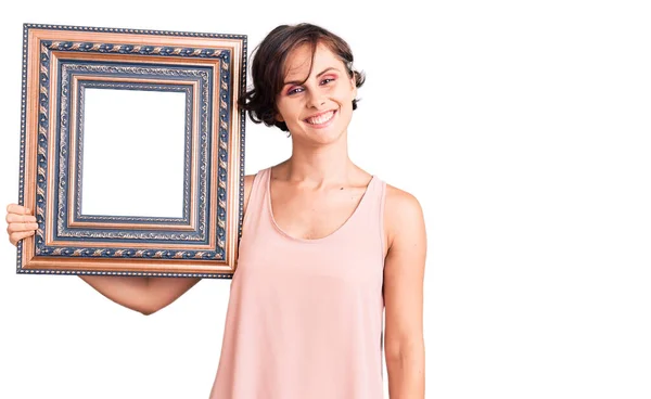 Beautiful Young Woman Short Hair Holding Empty Frame Looking Positive — Stock Photo, Image