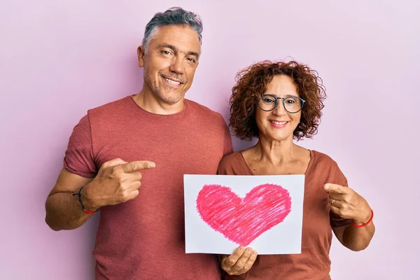 Beautiful Middle Age Couple Holding Heart Draw Smiling Happy Pointing — Stock Photo, Image