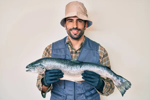 Handsome Hispanic Man Beard Showing Raw Salmon Smiling Happy Cool — Stock Photo, Image