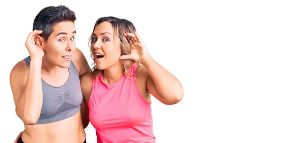 Couple Women Wearing Sportswear Smiling Hand Ear Listening Hearing Rumor — Stock Photo, Image
