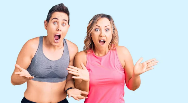 Couple Women Wearing Sportswear Celebrating Crazy Amazed Success Arms Raised — Stock Photo, Image