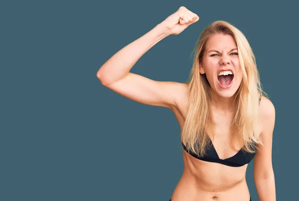 Young Beautiful Blonde Woman Wearing Bikini Angry Mad Raising Fist — Stock Photo, Image