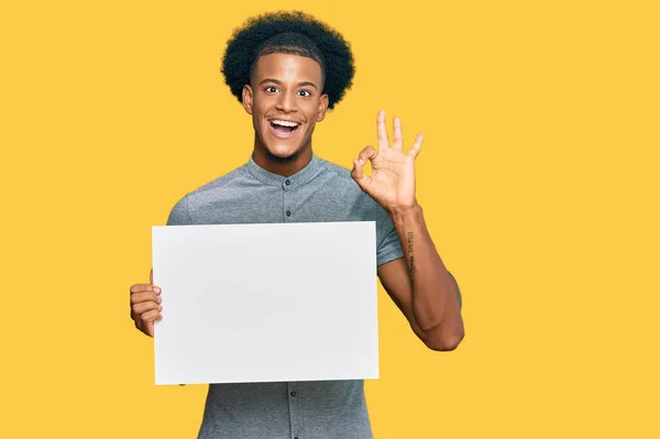 African American Man Afro Hair Holding Blank Empty Banner Doing — Stock Photo, Image