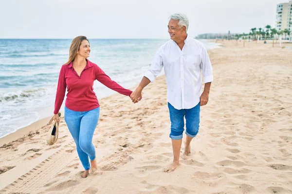 Pareja Hispana Mediana Edad Sonriendo Feliz Caminando Playa —  Fotos de Stock