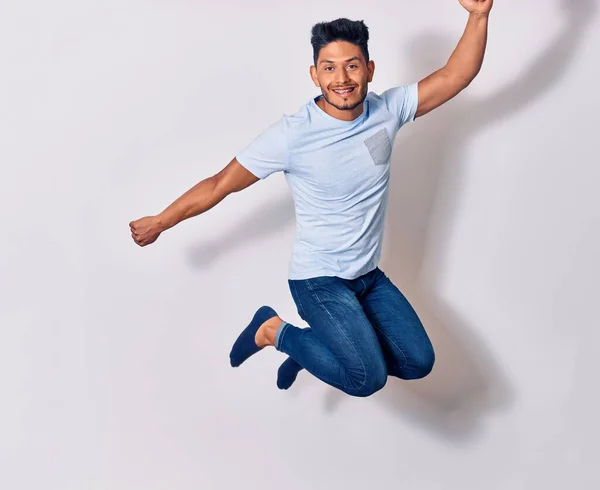 Young Handsome Latin Man Wearing Casual Clothes Smiling Happy Jumping — Stock Photo, Image