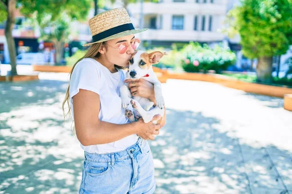 Young Beautiful Blonde Woman Hugging Cuddling Puppy Dog Outdoors — Stock Photo, Image