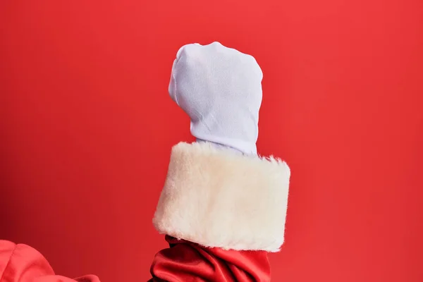Ręka Mężczyzny Ubranego Strój Świętego Mikołaja Rękawiczki Czerwonym Tle Protestującego — Zdjęcie stockowe