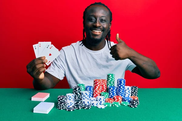 Handsome Young Black Man Playing Poker Holding Cards Smiling Happy — Stock Photo, Image