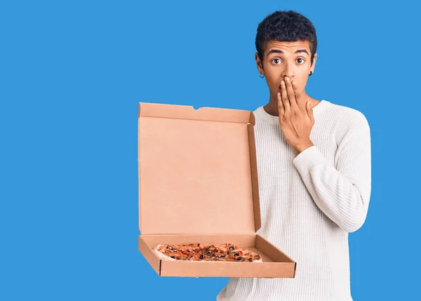 Young African Amercian Man Holding Delivery Pizza Box Covering Mouth — Stock Photo, Image