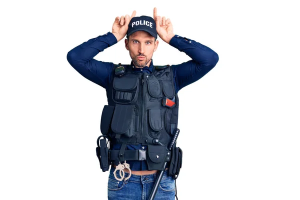 Young Handsome Man Wearing Police Uniform Doing Funny Gesture Finger — Stock Photo, Image