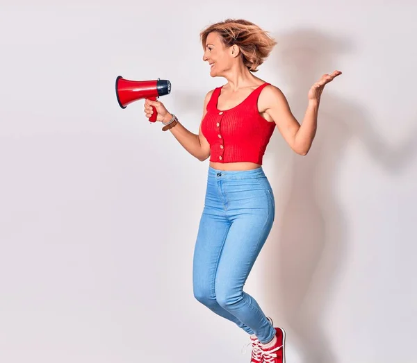 Young Beautiful Caucasian Woman Screaming Using Megaphone Jumping Isolated White — Stock Photo, Image