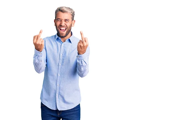 Young Handsome Blond Man Wearing Elegant Shirt Showing Middle Finger — Stockfoto