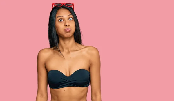 Young African American Woman Wearing Bikini Puffing Cheeks Funny Face — 스톡 사진