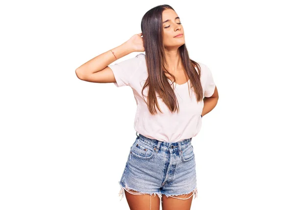 Young Hispanic Woman Wearing Casual White Tshirt Suffering Neck Ache — Stock Photo, Image