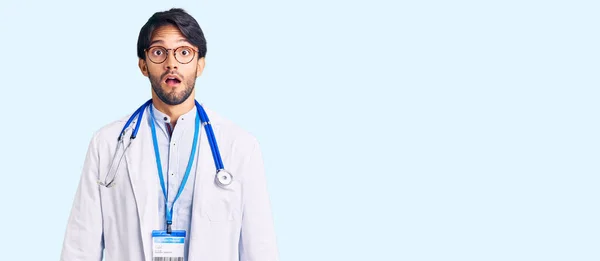 Handsome Hispanic Man Wearing Doctor Uniform Stethoscope Scared Amazed Open — Stock Photo, Image