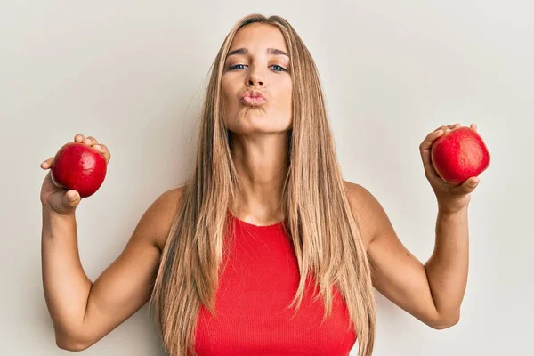 Young Blonde Woman Holding Red Apples Looking Camera Blowing Kiss — Stock Photo, Image
