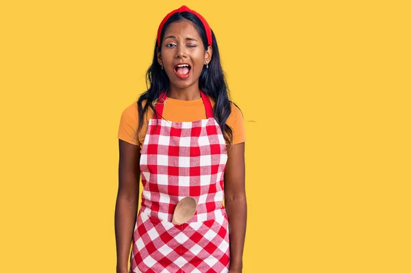 Young Indian Girl Wearing Professional Baker Apron Winking Looking Camera — Stock Photo, Image