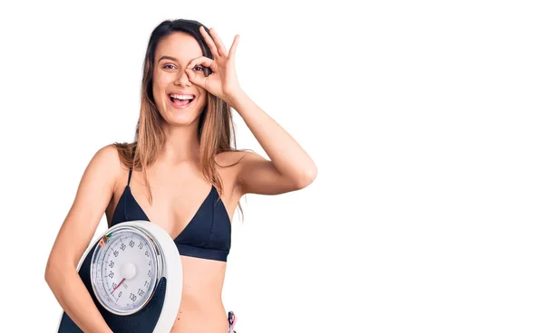 Young Beautiful Girl Wearing Bikini Holding Weighing Machine Smiling Happy — Stock Photo, Image