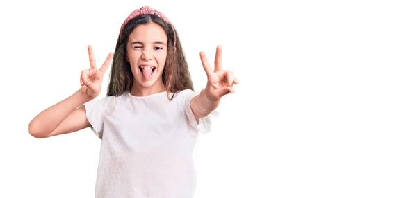 Cute Hispanic Child Girl Wearing Casual White Tshirt Smiling Tongue — Stock Photo, Image