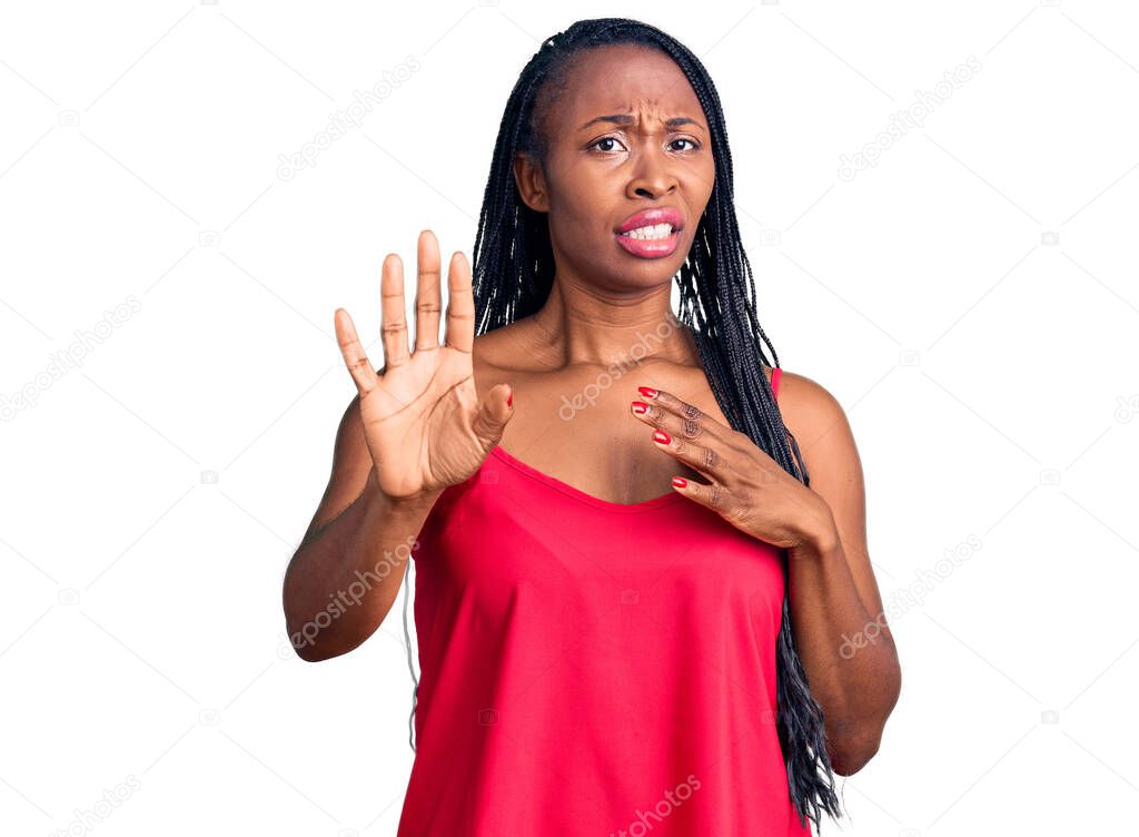 Young african american woman wearing casual clothes disgusted expression, displeased and fearful doing disgust face because aversion reaction. with hands raised 