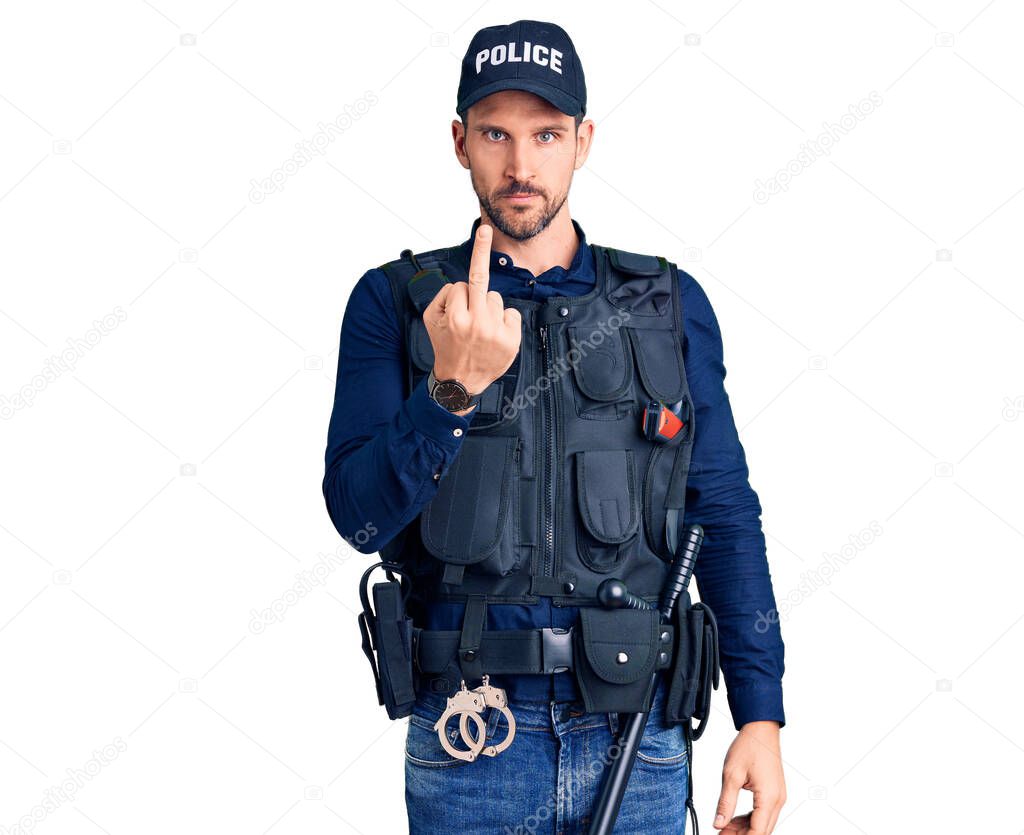 Young handsome man wearing police uniform showing middle finger, impolite and rude fuck off expression 
