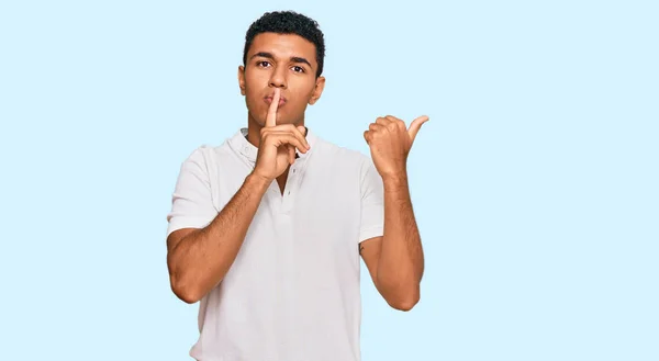 Young Arab Man Wearing Casual Clothes Asking Quiet Finger Lips — Stock Photo, Image