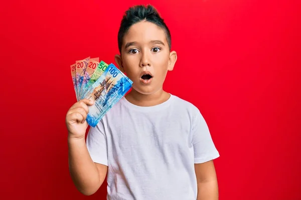 Little Boy Hispanic Kid Holding Swiss Franc Banknotes Scared Amazed — Stock Photo, Image