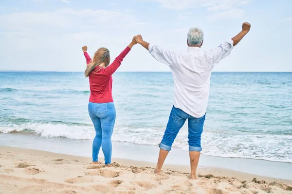 Middle Age Hispanic Couple Breathing Arms Raised Beach — Stock Photo, Image