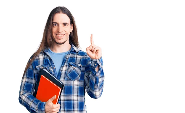 Homem Adulto Jovem Com Cabelos Longos Segurando Livro Colagem Surpreso — Fotografia de Stock